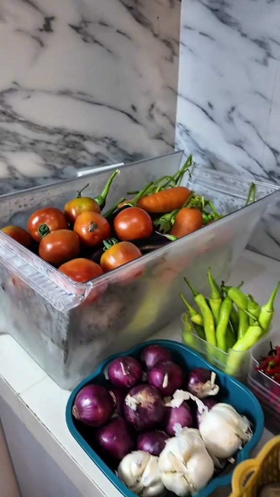 What happens after the market — washing, portioning and putting a week of food away.